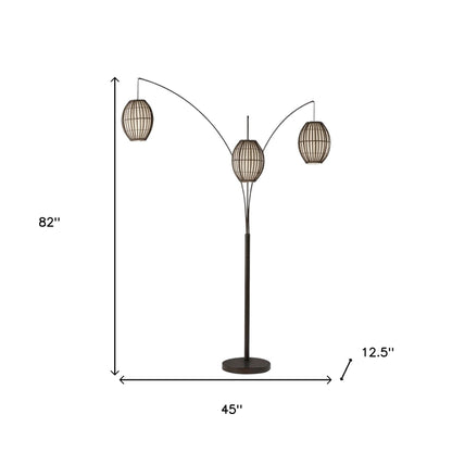 82" Antiqued Bronze Three Light Tree Floor Lamp With Beige Rattan Cage Shades