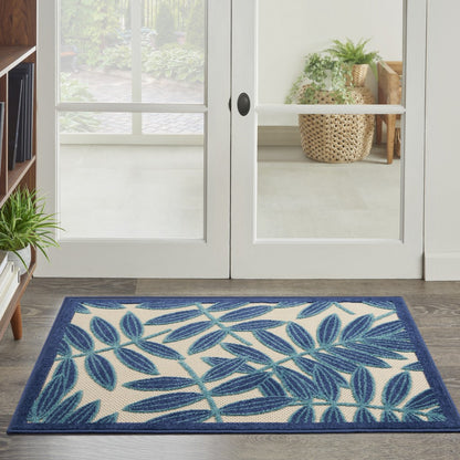 7' X 10' Blue And Ivory Floral Stain Resistant Indoor Outdoor Area Rug