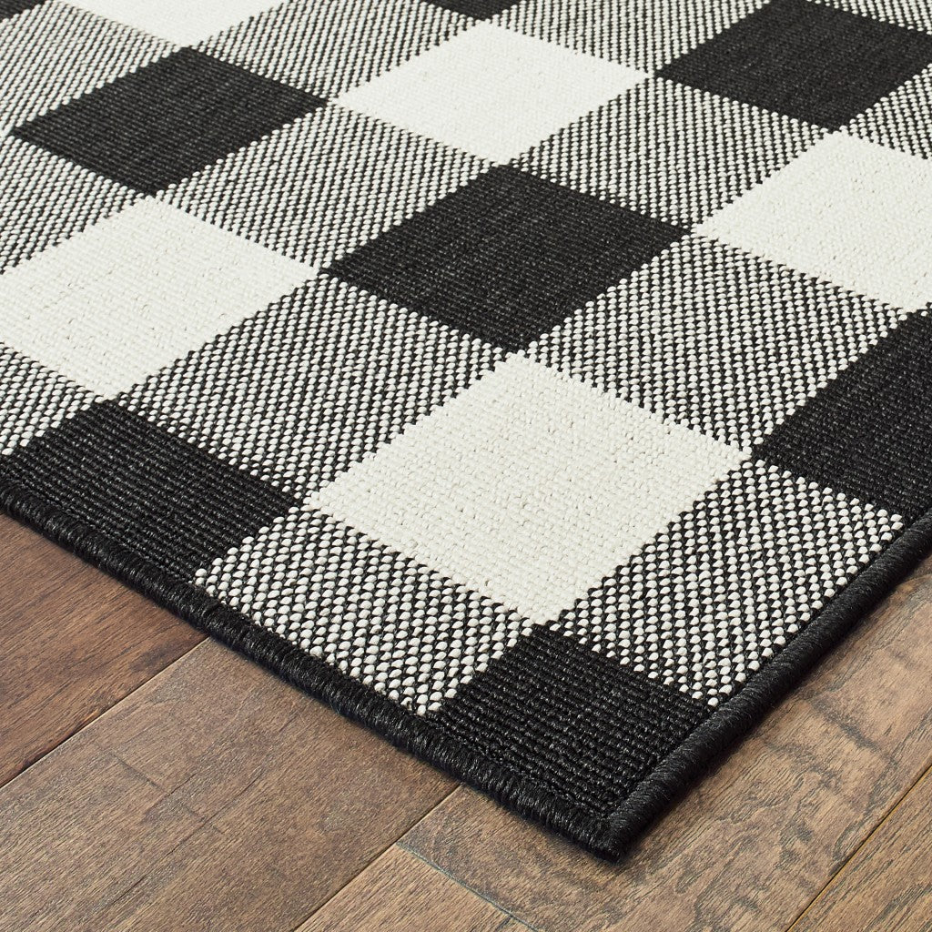 2' X 8' Black and Ivory Indoor Outdoor Area Rug