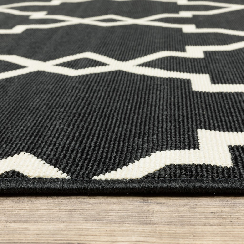 8' X 11' Black and Ivory Indoor Outdoor Area Rug