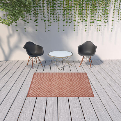 5' X 7' Coral Orange Argyle Indoor Outdoor Area Rug