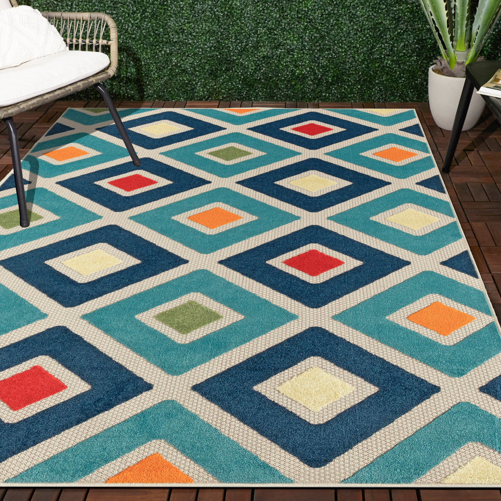 4' X 6' Blue And Ivory Geometric Stain Resistant Indoor Outdoor Area Rug