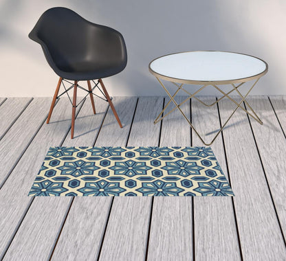 2' X 4' Ivory and Blue Geometric Stain Resistant Indoor Outdoor Area Rug