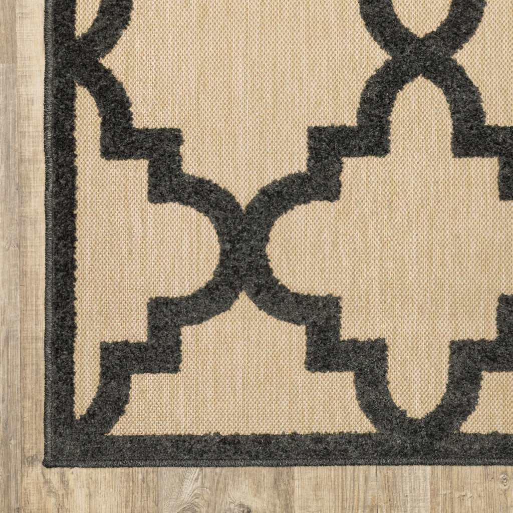 2' X 8' Beige and Black Geometric Stain Resistant Indoor Outdoor Area Rug