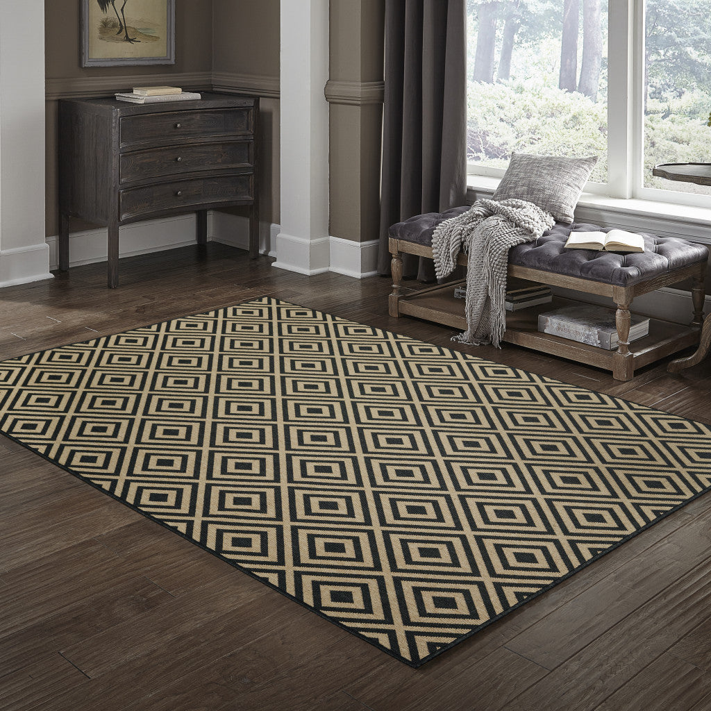 2' X 4' Black and Tan Geometric Stain Resistant Indoor Outdoor Area Rug