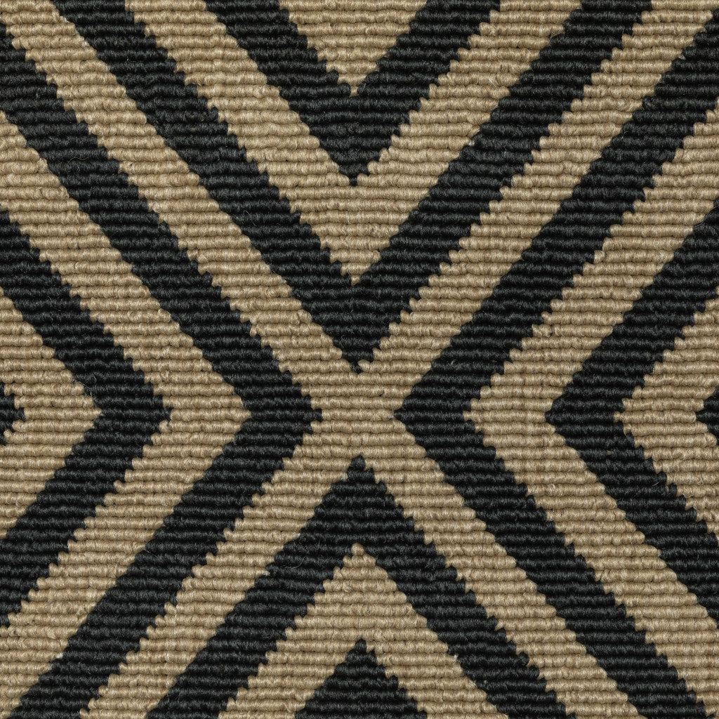 2' X 4' Black and Tan Geometric Stain Resistant Indoor Outdoor Area Rug