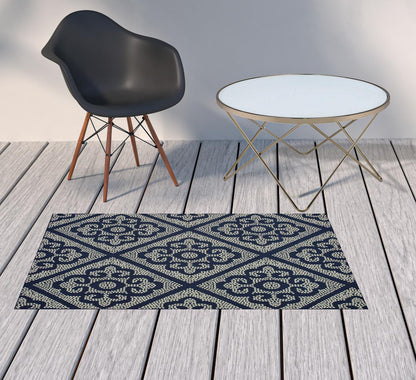 2' X 4' Blue and Ivory Geometric Stain Resistant Indoor Outdoor Area Rug