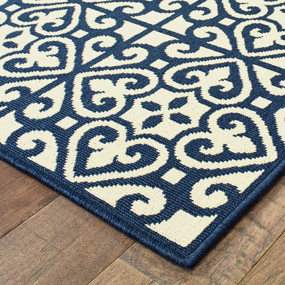 4' X 6' Ivory and Blue Geometric Stain Resistant Indoor Outdoor Area Rug