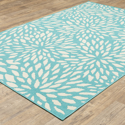 7' x 10' Blue and Ivory Floral Stain Resistant Indoor Outdoor Area Rug