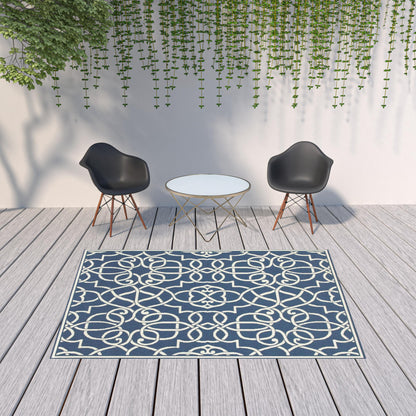 7' X 10' Blue and Ivory Geometric Stain Resistant Indoor Outdoor Area Rug