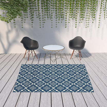 7' x 10' Blue and Ivory Floral Stain Resistant Indoor Outdoor Area Rug