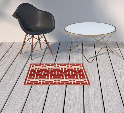 2' X 3' Red and Ivory Geometric Stain Resistant Indoor Outdoor Area Rug