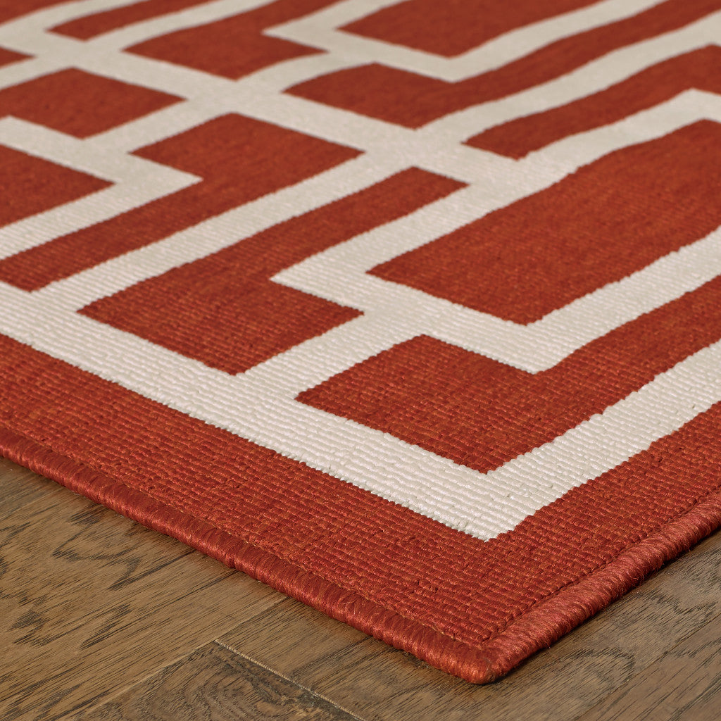 4' X 6' Red and Ivory Geometric Stain Resistant Indoor Outdoor Area Rug