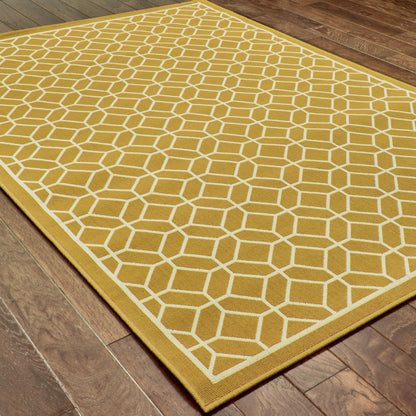 9' X 13' Gold and Ivory Geometric Stain Resistant Indoor Outdoor Area Rug