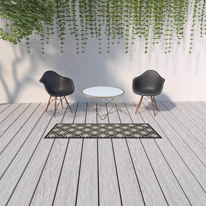 2' X 7' Beige and Black Geometric Stain Resistant Indoor Outdoor Area Rug