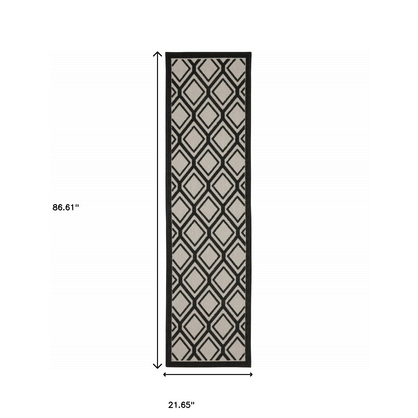 2' X 7' Beige and Black Geometric Stain Resistant Indoor Outdoor Area Rug