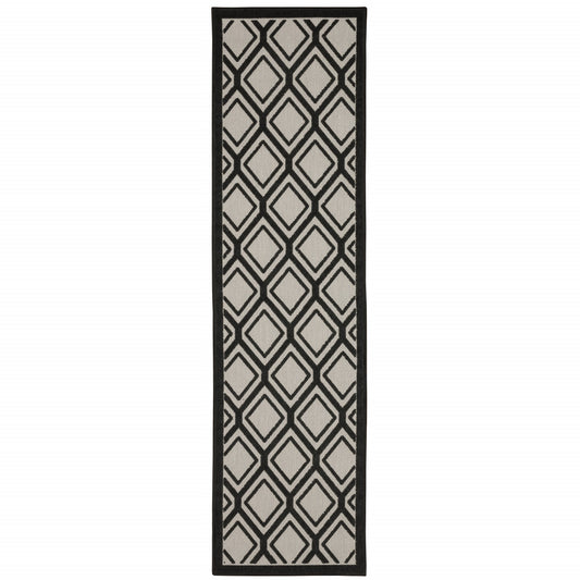 2' X 7' Beige and Black Geometric Stain Resistant Indoor Outdoor Area Rug