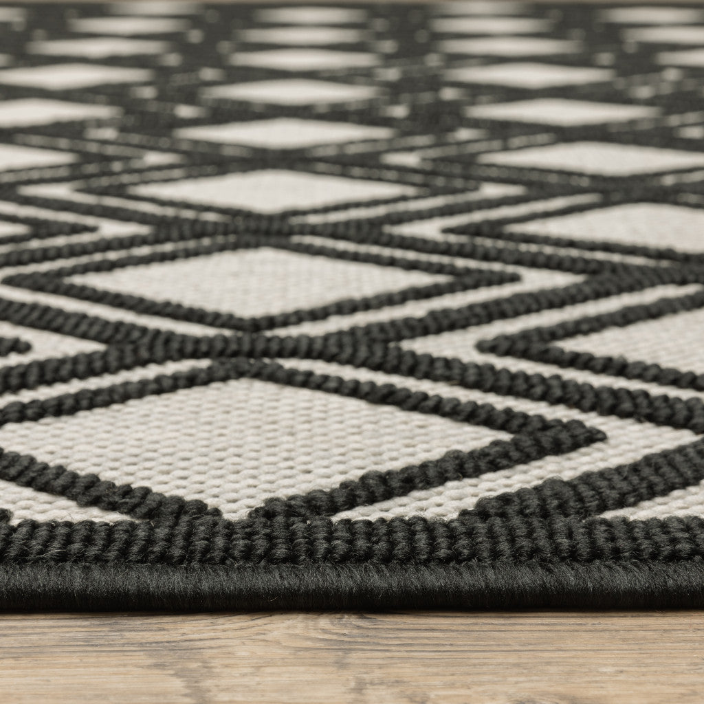 5' X 7' Beige and Black Geometric Stain Resistant Indoor Outdoor Area Rug