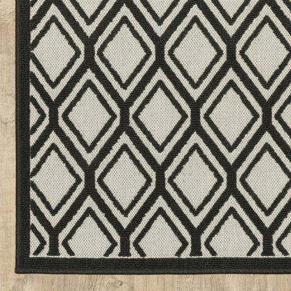 5' X 7' Beige and Black Geometric Stain Resistant Indoor Outdoor Area Rug