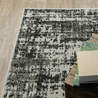 2' X 7' Beige and Black Abstract Stain Resistant Indoor Outdoor Area Rug