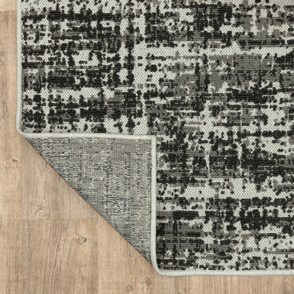 5' X 7' Beige and Black Abstract Stain Resistant Indoor Outdoor Area Rug