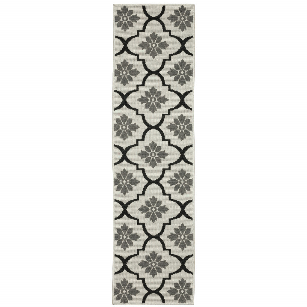 2' X 7' Beige and Black Geometric Stain Resistant Indoor Outdoor Area Rug