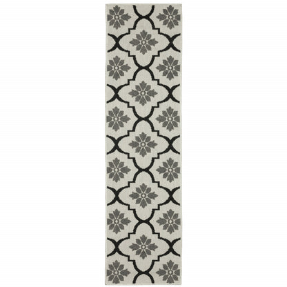 2' X 7' Beige and Black Geometric Stain Resistant Indoor Outdoor Area Rug