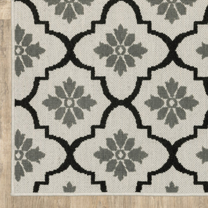 2' X 7' Beige and Black Geometric Stain Resistant Indoor Outdoor Area Rug