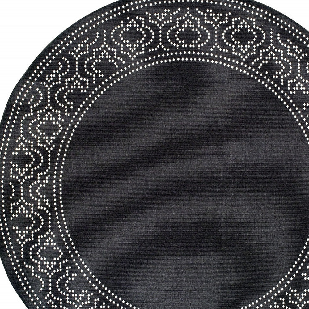 8' X 8' Black and Ivory Round Stain Resistant Indoor Outdoor Area Rug