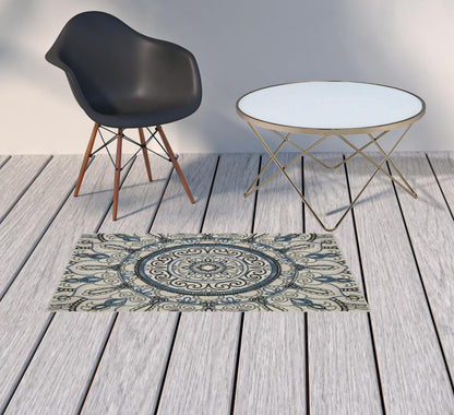 2' X 4' Blue and Beige Geometric Stain Resistant Indoor Outdoor Area Rug