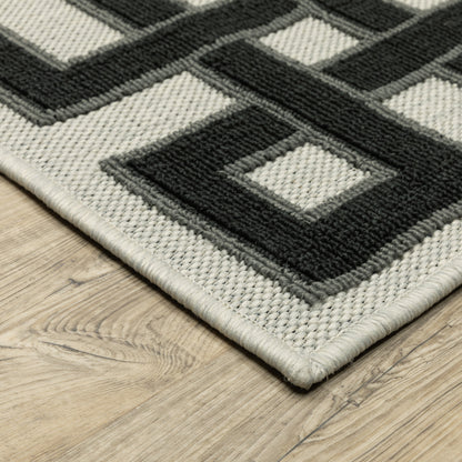 2' X 4' Beige and Black Stain Resistant Indoor Outdoor Area Rug