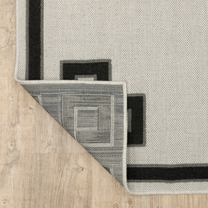 7' X 9' Beige and Black Stain Resistant Indoor Outdoor Area Rug