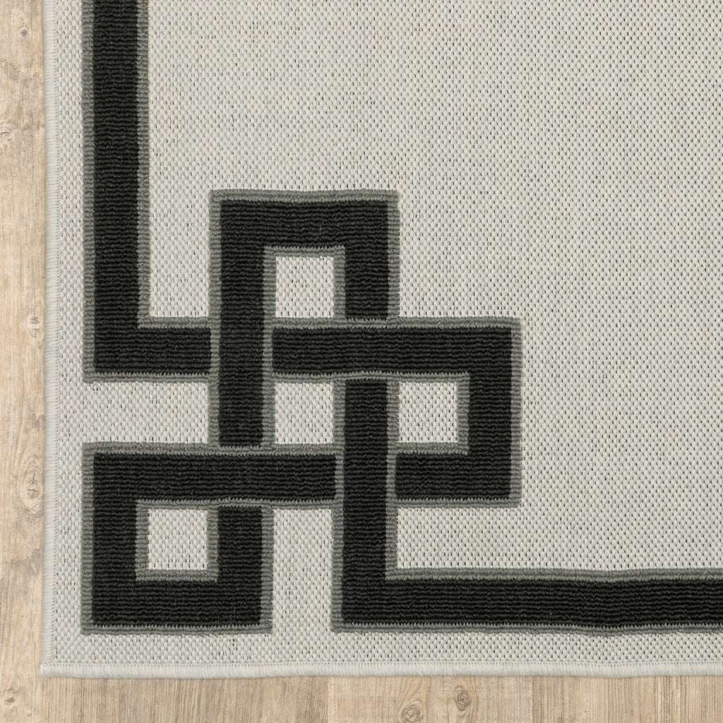 7' X 9' Beige and Black Stain Resistant Indoor Outdoor Area Rug