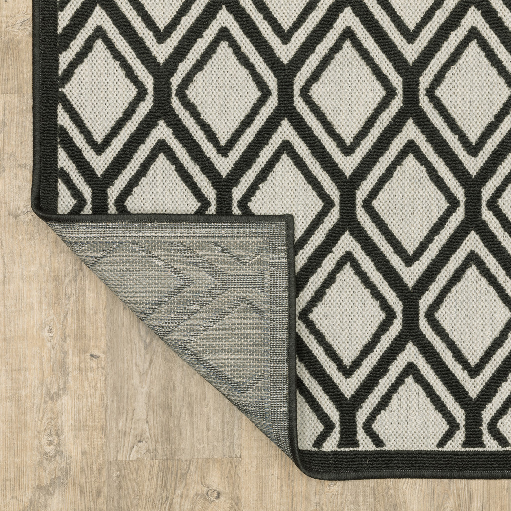 2' X 4' Beige and Black Geometric Stain Resistant Indoor Outdoor Area Rug