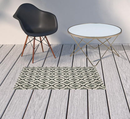 2' X 4' Beige and Black Geometric Stain Resistant Indoor Outdoor Area Rug