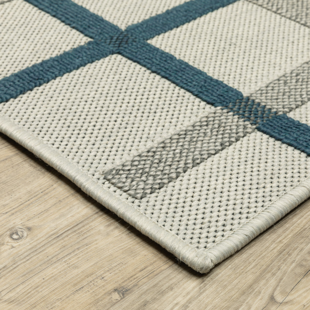 2' X 4' Blue and Beige Geometric Stain Resistant Indoor Outdoor Area Rug