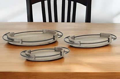 Set Of Three Brown Oval Wood and Metal Serving Trays With Handles