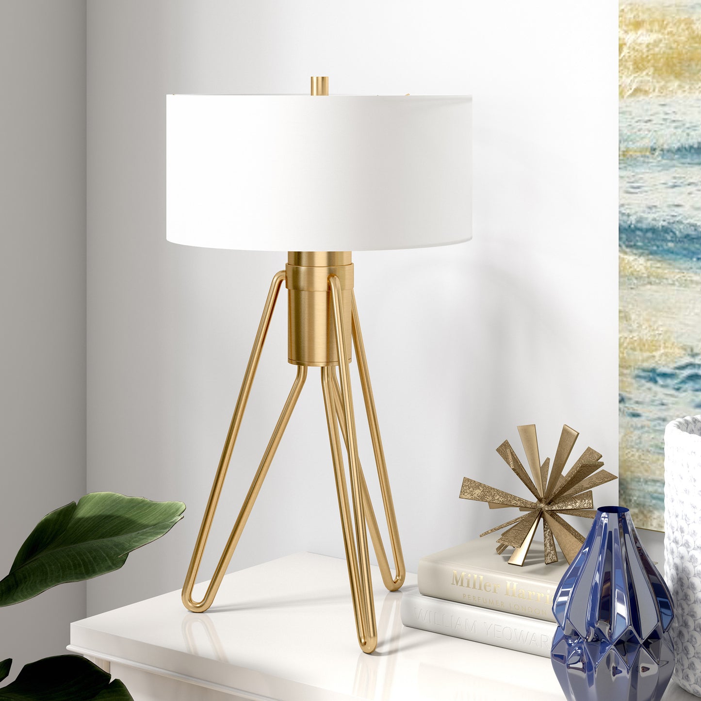 25" Brass Metal Two Light Tripod Table Lamp With White Drum Shade