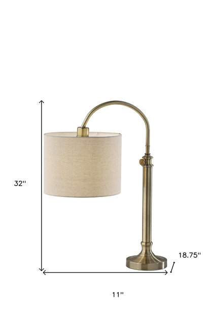 32" Antiqued Brass Metal Adjustable Arched Lamp With Beige Drum Shade