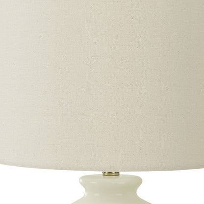 26" Gold and Ivory Ceramic Urn Table Lamp With Cream Drum Shade